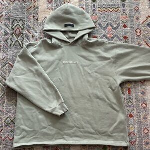 Size large 
Essential hoodie
Seafoam green